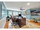 Spacious home office with custom built-ins, a ceiling fan and ample windows at 81517 Alexander, Chapel Hill, NC 27517