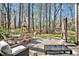A welcoming outdoor patio featuring comfortable seating and serene forest views at 81517 Alexander, Chapel Hill, NC 27517