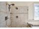 Modern shower design with tiled walls, dual shower heads, built-in shelves, and clear glass door for a luxurious experience at 81517 Alexander, Chapel Hill, NC 27517