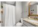 Bathroom with granite vanity, mirror and shower featuring white curtain at 8612 Keegan Ct, Raleigh, NC 27613