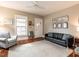 Bright living room with hardwood floors, neutral walls, comfortable seating, and an inviting open doorway at 914 Dorothea Dr, Raleigh, NC 27603