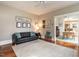 Inviting living room featuring hardwood floors, neutral paint colors, and comfortable seating and an open doorway at 914 Dorothea Dr, Raleigh, NC 27603