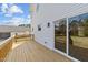 A lovely back deck with sliding glass doors and a view of the side yard at 1019 Thompson Rd, Four Oaks, NC 27524