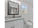 Contemporary bathroom featuring granite countertops and bright, natural lighting at 1019 Thompson Rd, Four Oaks, NC 27524