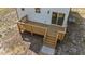 A backyard deck featuring wooden stairs and railings at 1019 Thompson Rd, Four Oaks, NC 27524