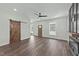 Open living area with wood-look floors, recessed lighting, barn door, and lots of natural light at 1019 Thompson Rd, Four Oaks, NC 27524