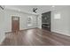 Bright living room featuring a modern fireplace, wood-look flooring and a ceiling fan at 1019 Thompson Rd, Four Oaks, NC 27524