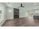Open living space boasts a modern fireplace, unique wall design, and access to the kitchen at 1019 Thompson Rd, Four Oaks, NC 27524