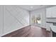 Living area features a unique geometric wall design and sliding doors to the outdoor deck at 1019 Thompson Rd, Four Oaks, NC 27524
