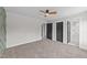 Spacious main bedroom featuring neutral carpeting and multiple doorways at 1019 Thompson Rd, Four Oaks, NC 27524
