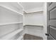 Bright walk-in closet featuring built-in shelving and wood rods, offering ample storage space at 1019 Thompson Rd, Four Oaks, NC 27524