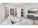 Cozy living room area with comfortable seating, a tv, and ample storage with natural light from windows and doors at 10320 Sablewood Dr # 107, Raleigh, NC 27617