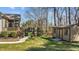 Lush backyard featuring a well-manicured lawn, landscaping, and a storage shed at 1046 Lawrence Rd, Wake Forest, NC 27587