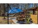 Backyard retreat with hammock, picnic table, and custom wooden pavilion at 1046 Lawrence Rd, Wake Forest, NC 27587