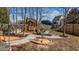 Backyard featuring a hammock, a wooden pavilion, and a decorative garden area at 1046 Lawrence Rd, Wake Forest, NC 27587