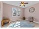 Bedroom featuring neutral walls, carpet, ceiling fan, small furniture, and a window for natural light at 1046 Lawrence Rd, Wake Forest, NC 27587