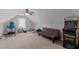 Bonus room with vintage arcade game, neutral carpet, and natural light at 1046 Lawrence Rd, Wake Forest, NC 27587