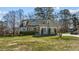 Charming two-story home with a well-manicured lawn and a welcoming front porch at 1046 Lawrence Rd, Wake Forest, NC 27587