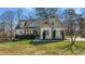 Charming home featuring manicured landscaping, complemented by a well-maintained lawn at 1046 Lawrence Rd, Wake Forest, NC 27587