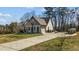 Well-maintained home with a driveway, two-car garage, and a well-landscaped front yard at 1046 Lawrence Rd, Wake Forest, NC 27587