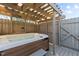 Relaxing hot tub under a wooden pergola, perfect for outdoor leisure at 1046 Lawrence Rd, Wake Forest, NC 27587