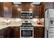 Updated kitchen featuring stainless steel appliances, granite counters, and plenty of storage at 1046 Lawrence Rd, Wake Forest, NC 27587