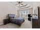 Comfortable main bedroom features trey ceilings, neutral walls, large window, carpet, and contemporary furniture at 1046 Lawrence Rd, Wake Forest, NC 27587