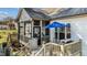 Enclosed porch featuring table, grill, and stylish outdoor seating at 1046 Lawrence Rd, Wake Forest, NC 27587
