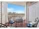 Inviting balcony furnished with seating, offering scenic views of the lake at 10511 Rosegate Ct # 203, Raleigh, NC 27617