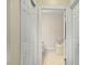 Bathroom featuring a tiled floor, a soaking tub, and an open doorway leading to an adjacent room at 10511 Rosegate Ct # 203, Raleigh, NC 27617