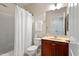 Bathroom features a shower with curtain, and a wood vanity with a white sink at 10511 Rosegate Ct # 203, Raleigh, NC 27617