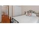 Cozy bedroom featuring a wrought iron bed frame and closet for ample storage at 10511 Rosegate Ct # 203, Raleigh, NC 27617