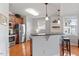 Modern kitchen with stainless steel appliances, granite countertops, and a breakfast bar at 10511 Rosegate Ct # 203, Raleigh, NC 27617