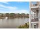 Picturesque view of the lake with fountains from the unit's balcony at 10511 Rosegate Ct # 203, Raleigh, NC 27617