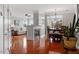 Spacious open concept featuring hardwood floors, fireplace, dining area with chandelier and comfortable seating at 10511 Rosegate Ct # 203, Raleigh, NC 27617