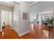 Open-concept living space featuring hardwood floors, fireplace, dining area with chandelier, and comfortable seating at 10511 Rosegate Ct # 203, Raleigh, NC 27617