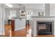 Stylish living space showcasing a breakfast bar with seating, a fireplace and bright windows at 10511 Rosegate Ct # 203, Raleigh, NC 27617