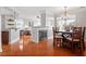 Inviting living space featuring a fireplace, open dining area, a breakfast bar with counter seating at 10511 Rosegate Ct # 203, Raleigh, NC 27617