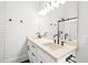 Elegant bathroom with a double sink vanity, white cabinets, and a large mirror at 1100 Reatkin Ln, Graham, NC 27253