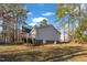View of a backyard with trees and a deck at 1107 Goldendale Dr, Durham, NC 27703