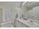 Clean bathroom with double sinks, a large mirror, and neutral colors at 1107 Goldendale Dr, Durham, NC 27703