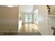 View of a kitchenette featuring french doors to the exterior, hardwood floors and an abundance of natural light at 1107 Goldendale Dr, Durham, NC 27703