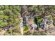 The aerial view shows a private home site surrounded by lush trees and a long driveway at 113 Pony Dr, Louisburg, NC 27549