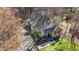 An elevated view displaying the home's private lot, back deck, and inviting exterior finishes at 113 Pony Dr, Louisburg, NC 27549