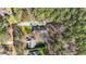 The aerial view shows a private home site surrounded by lush trees, homes, and a long driveway at 113 Pony Dr, Louisburg, NC 27549