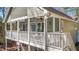 This spacious back deck is designed for entertaining and outdoor enjoyment with ceiling fans and great views at 113 Pony Dr, Louisburg, NC 27549