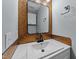 Stylish powder room with decorative mirror, designer fixtures and vanity at 113 Pony Dr, Louisburg, NC 27549