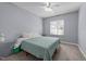 Cozy bedroom featuring a ceiling fan, window, and simple decor at 113 Pony Dr, Louisburg, NC 27549