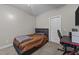 Bedroom with grey walls, bed and desk at 113 Pony Dr, Louisburg, NC 27549