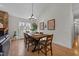 Bright dining room with hardwood floors and stylish light fixture at 113 Pony Dr, Louisburg, NC 27549